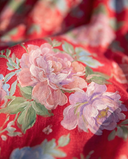 Women's floral V-neck maxi dress with short sleeves and a flowing skirt
