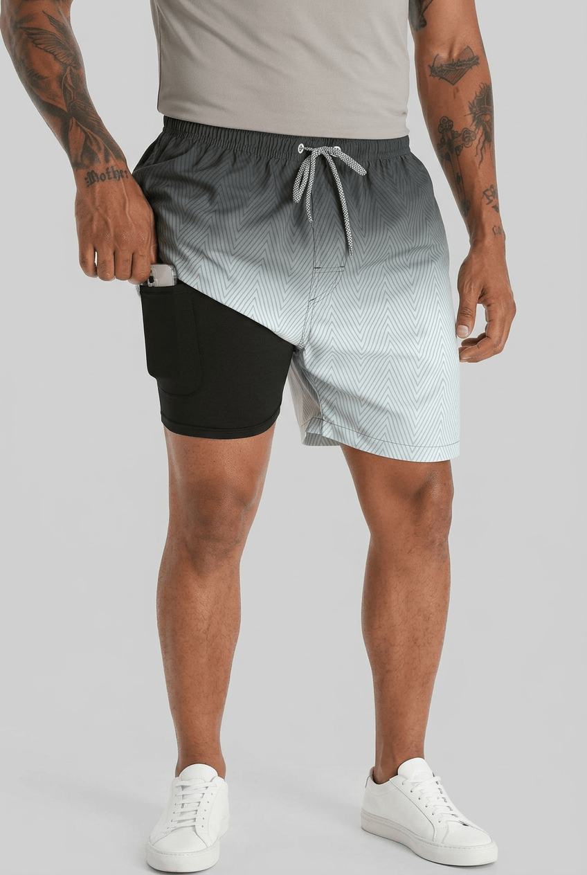 Men's printed swim shorts with drawstring waist and inner shorts
