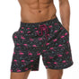 Men's printed swim shorts with elastic drawstring waist and side pockets