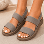 Women's open-toe walking sandals with wide textured straps and flat lugged soles