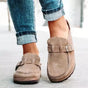 Women's mule sandals with round toes, side buckles and flat layered soles
