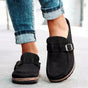 Women's mule sandals with round toes, side buckles and flat layered soles