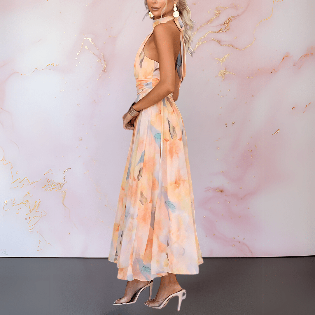 Women's orange watercolour halter midi dress with a flowing skirt