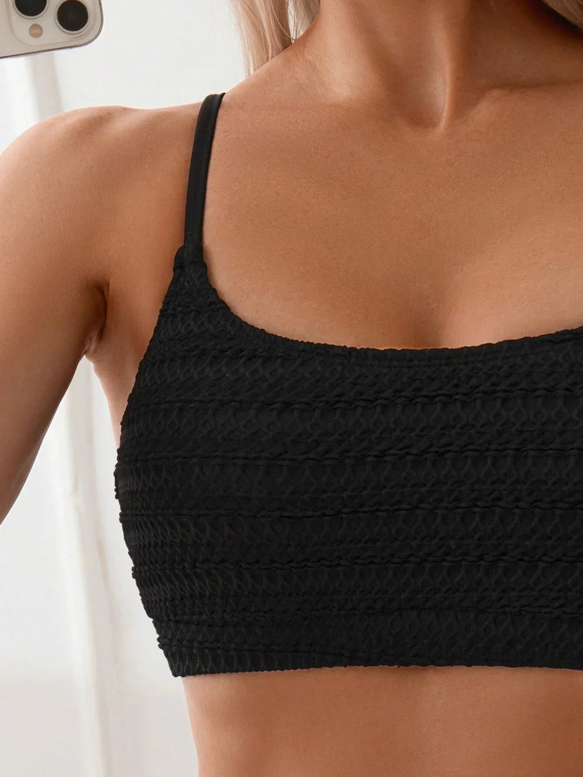 Women's black textured bikini with adjustable straps and high-waisted briefs