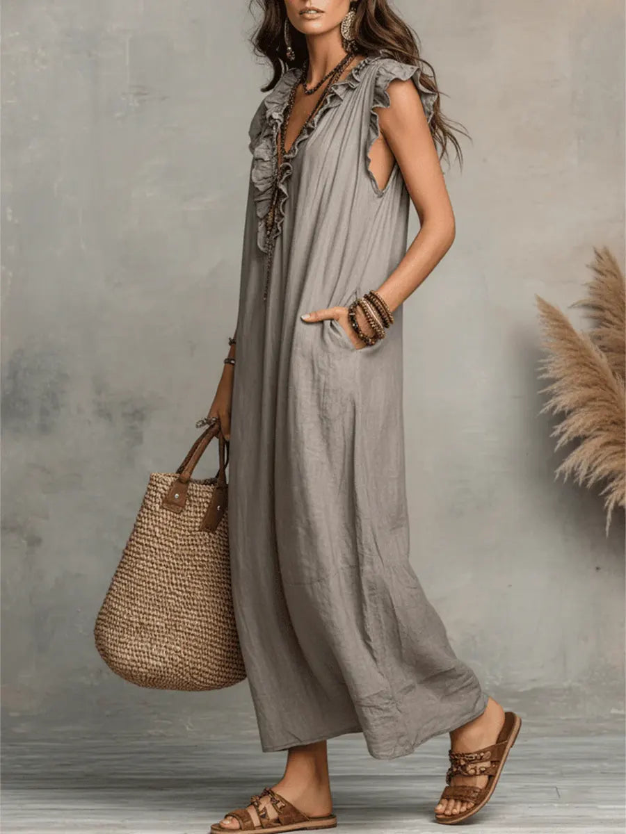 Women's bohemian maxi dress with ruffled V-neckline, cap sleeves and side pockets