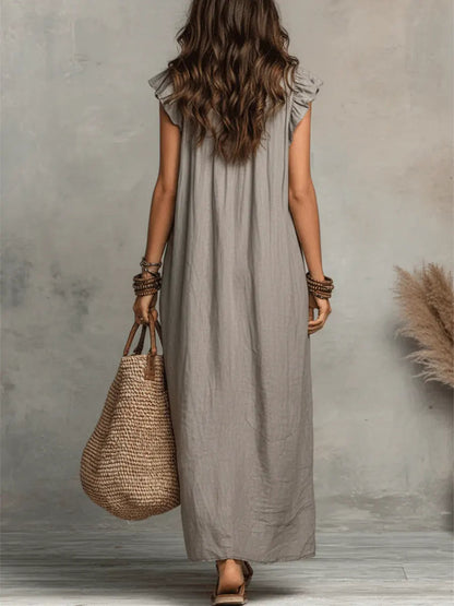 Women's bohemian maxi dress with ruffled V-neckline, cap sleeves and side pockets