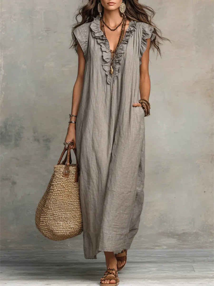 Women's bohemian maxi dress with ruffled V-neckline, cap sleeves and side pockets