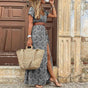 Women's floral maxi dress with V-neck, short sleeves, waist belt and side slit