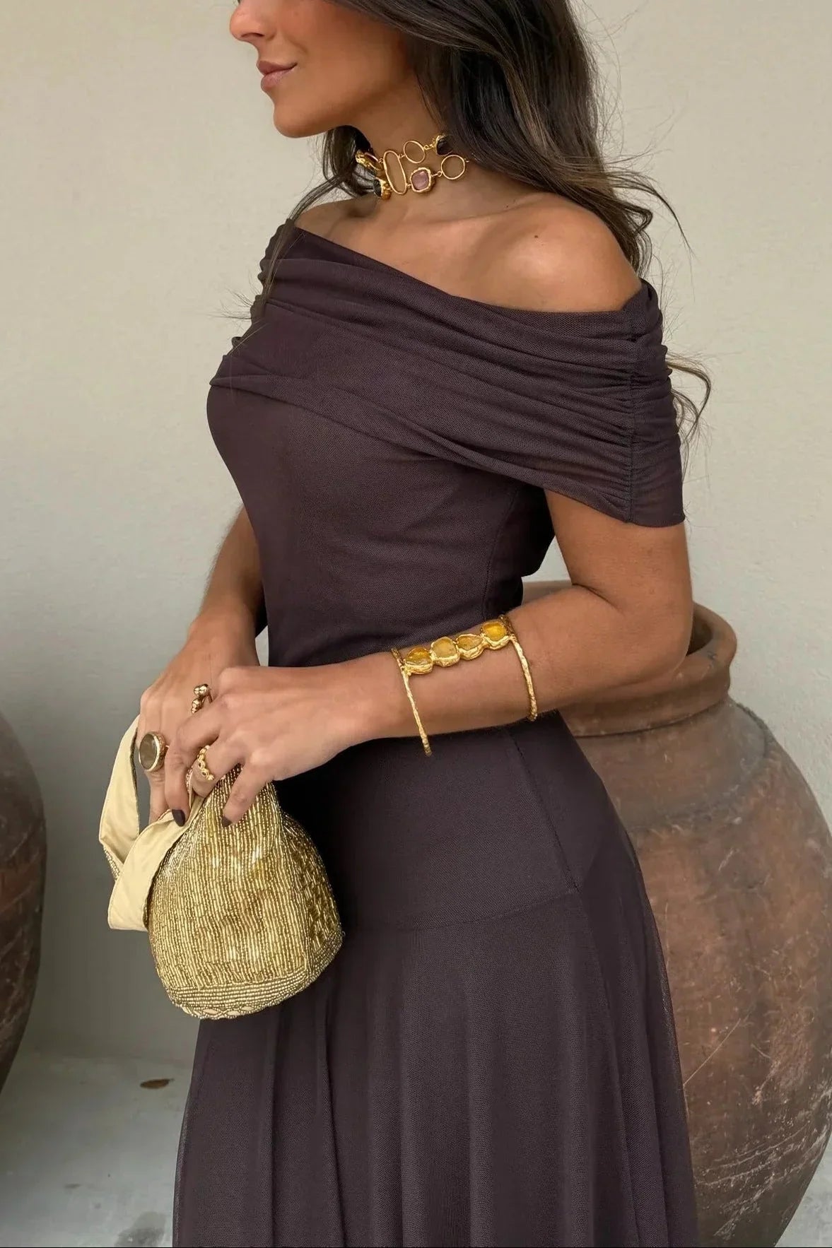 Women's pleated one-shoulder maxi dress with draped bodice and flowing skirt