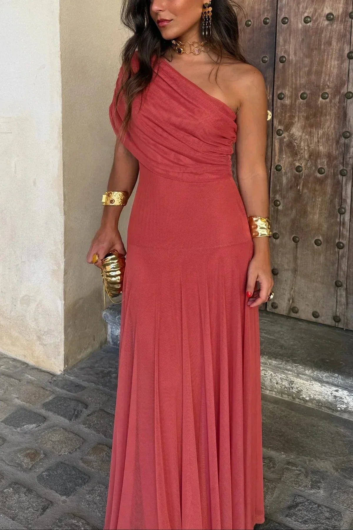 Women's pleated one-shoulder maxi dress with draped bodice and flowing skirt