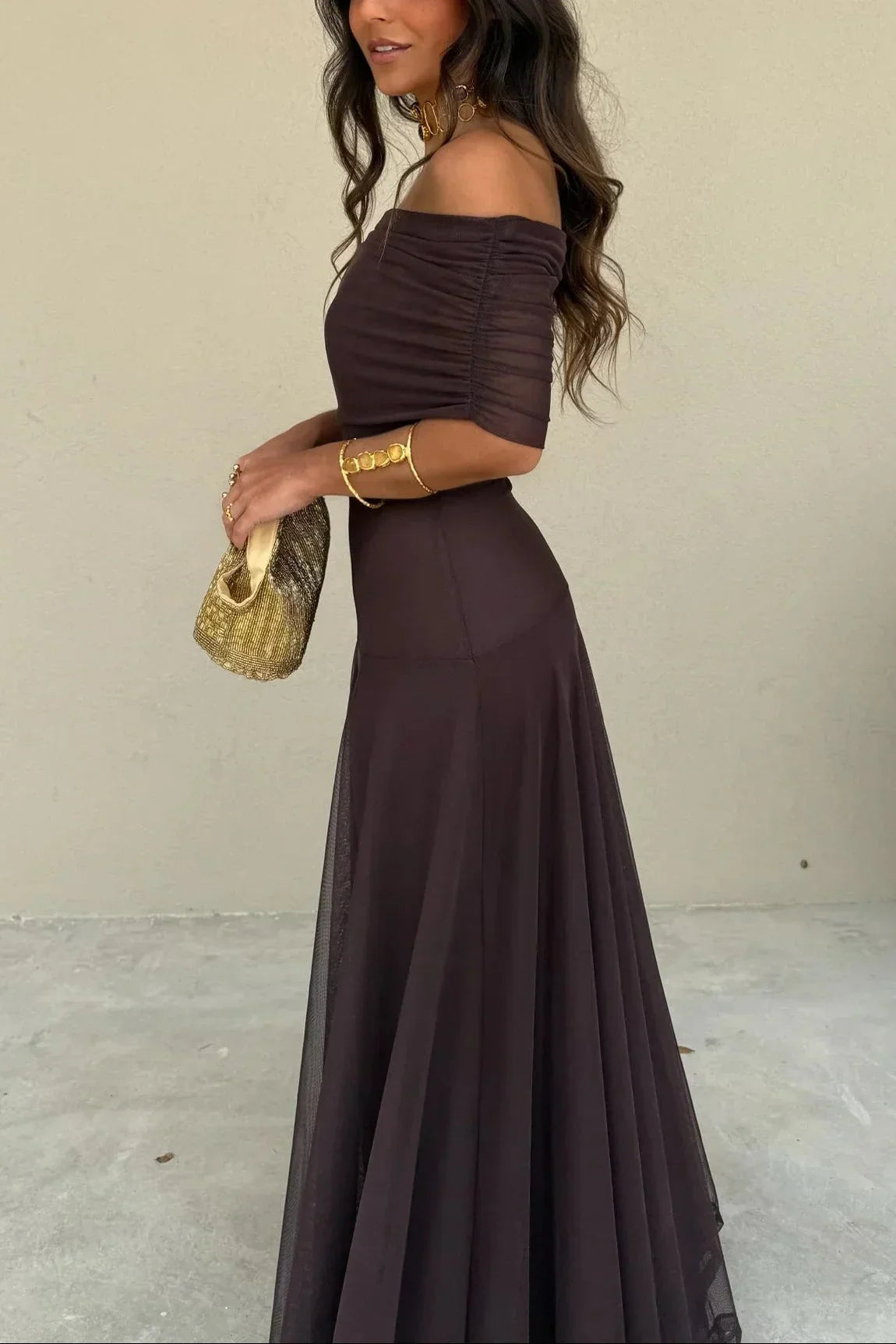 Women's pleated one-shoulder maxi dress with draped bodice and flowing skirt