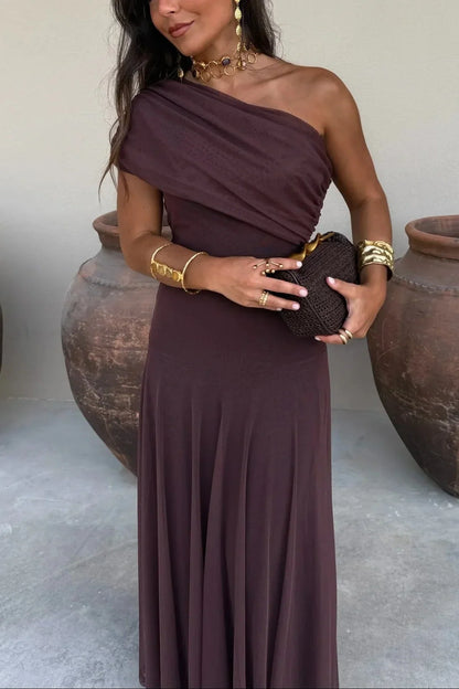 Women's pleated one-shoulder maxi dress with draped bodice and flowing skirt