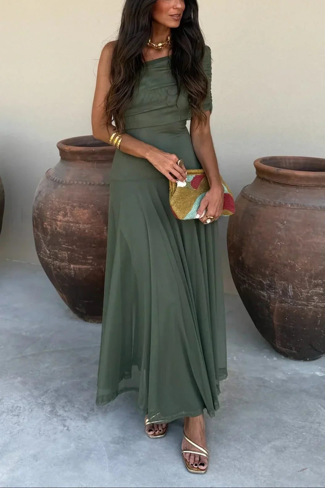 Women's pleated one-shoulder maxi dress with draped bodice and flowing skirt