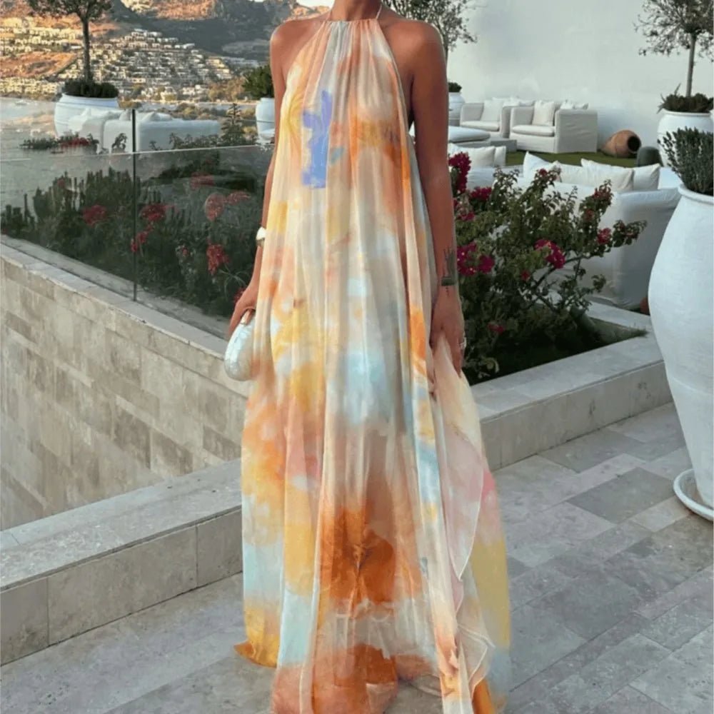 Women's abstract halter maxi dress with flowing sheer overlay and tie back