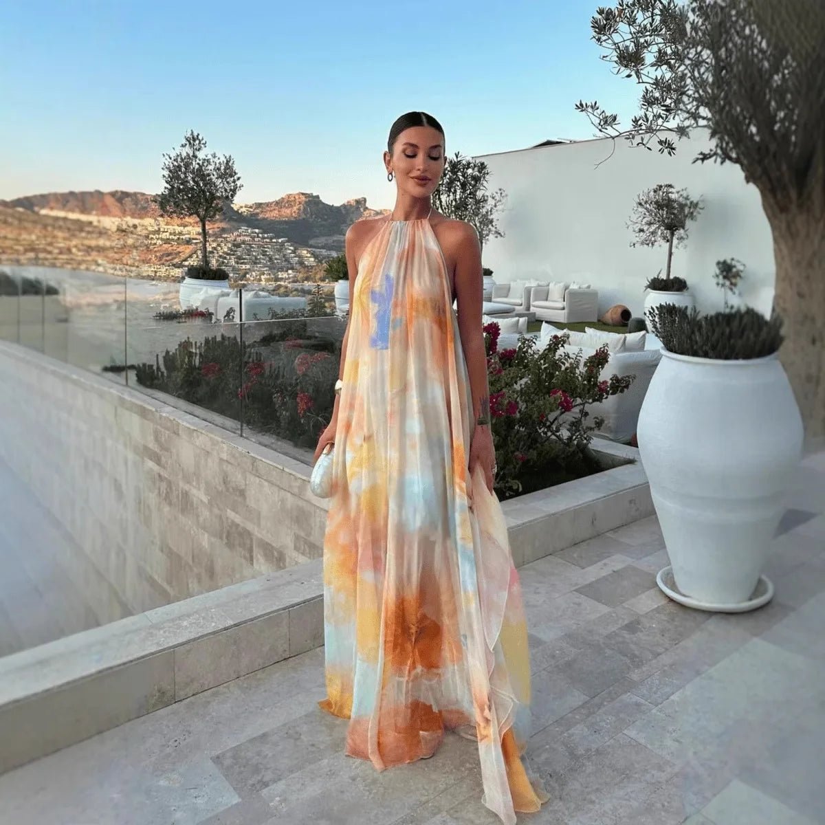 Women's abstract halter maxi dress with flowing sheer overlay and tie back