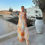 Women's abstract halter maxi dress with flowing sheer overlay and tie back