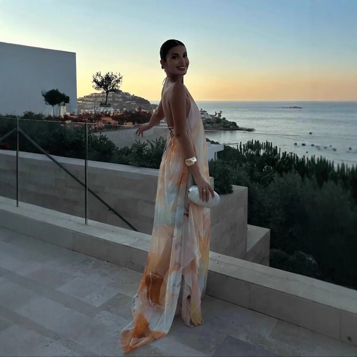 Women's abstract halter maxi dress with flowing sheer overlay and tie back