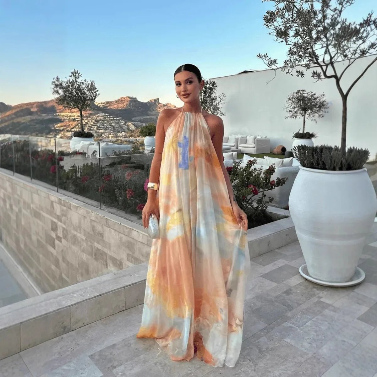 Women's abstract halter maxi dress with flowing sheer overlay and tie back