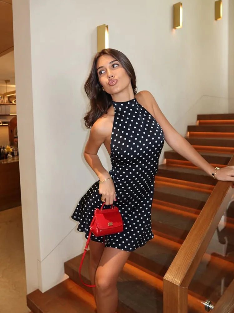 Women's polka dot halter mini dress with sleeveless cut and short flared skirt