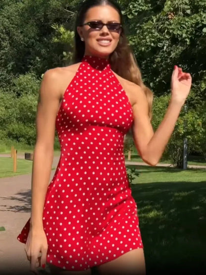 Women's polka dot halter mini dress with sleeveless cut and short flared skirt