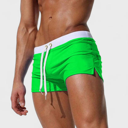 Men's short swim shorts with drawstring waist and side slit detail
