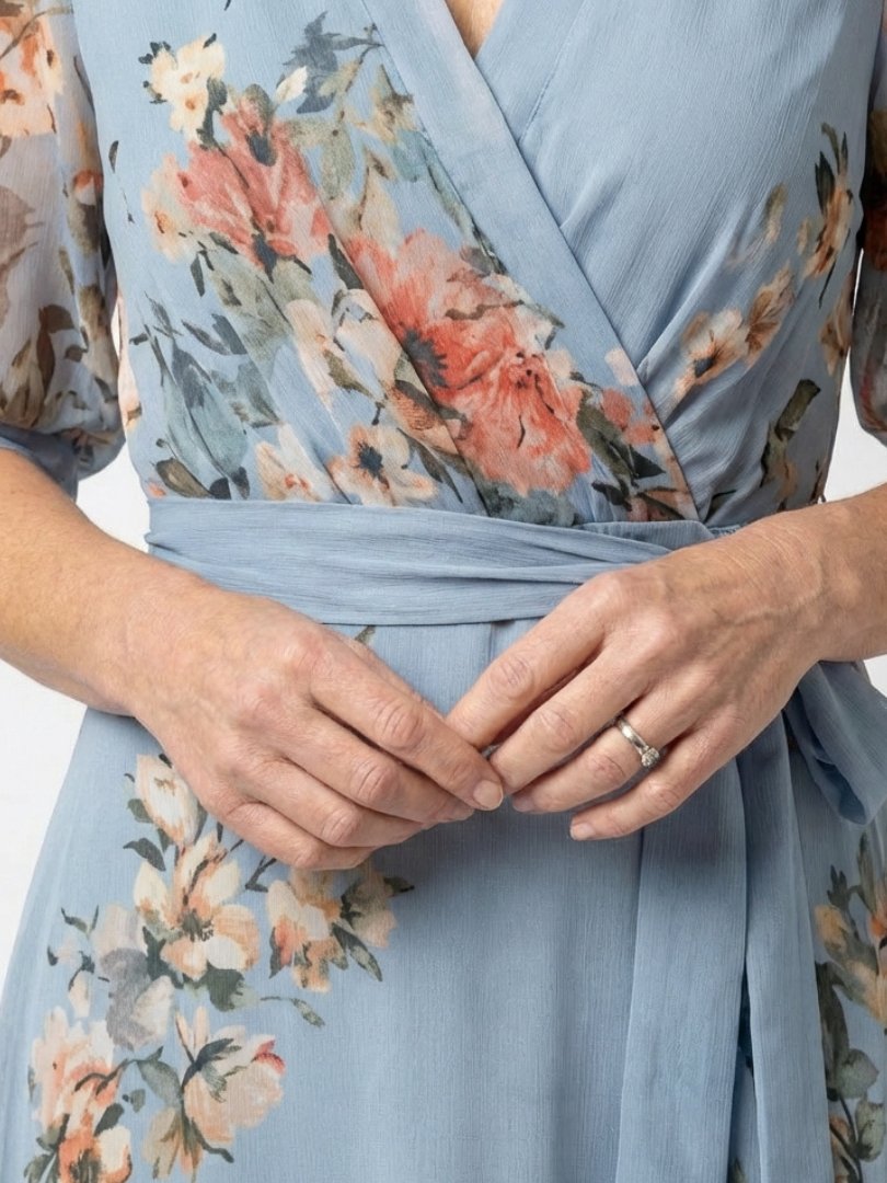 Women's blue floral wrap maxi dress with V-neckline and 3/4 sleeves