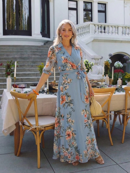 Women's blue floral wrap maxi dress with V-neckline and 3/4 sleeves