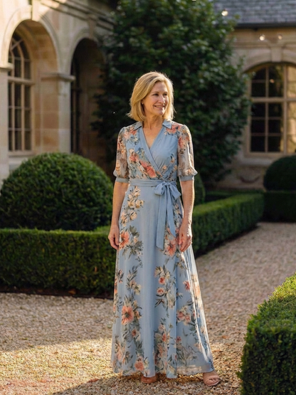 Women's blue floral wrap maxi dress with V-neckline and 3/4 sleeves