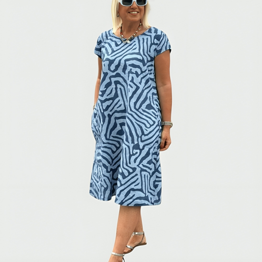 Women's abstract print midi dress with short sleeves and side pockets