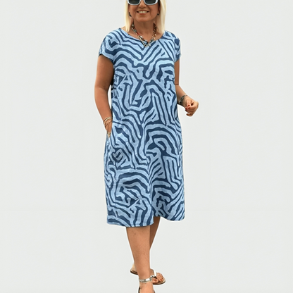 Women's abstract print midi dress with short sleeves and side pockets