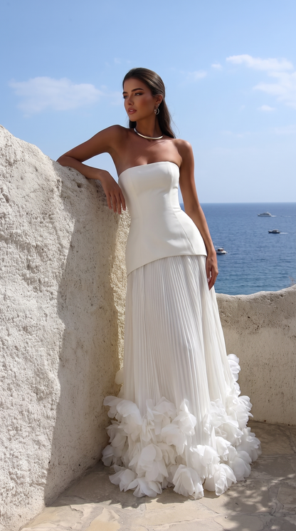 Women's strapless pleated maxi dress with floral appliqué hem