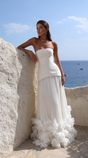 Women's strapless pleated maxi dress with floral appliqué hem