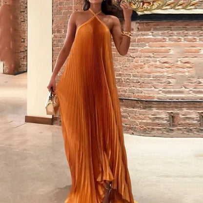 Women's orange pleated halter maxi dress with criss-cross neckline
