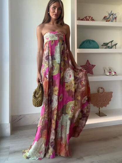 Women's strapless multicoloured floral maxi dress with flowing floor-length skirt
