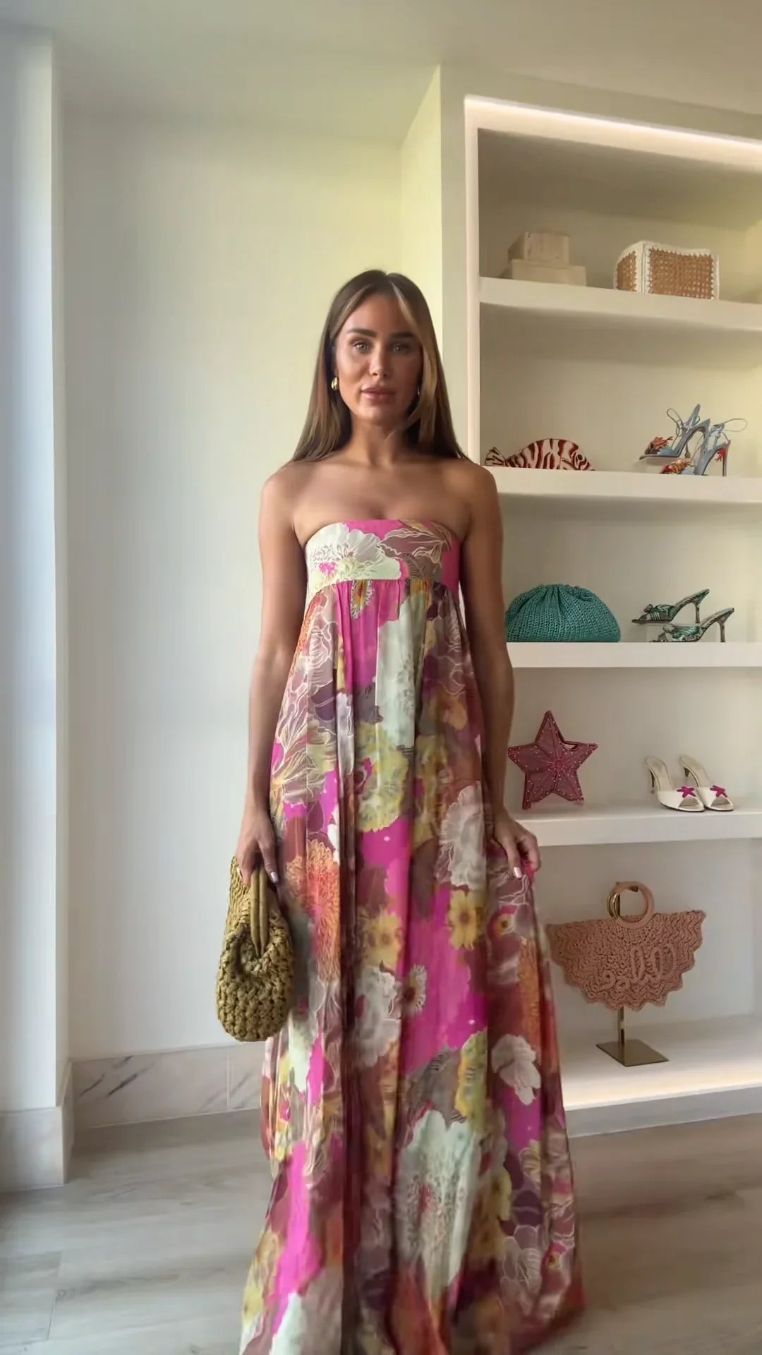 Women's strapless multicoloured floral maxi dress with flowing floor-length skirt