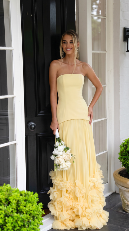 Women's strapless pleated maxi dress with floral appliqué hem
